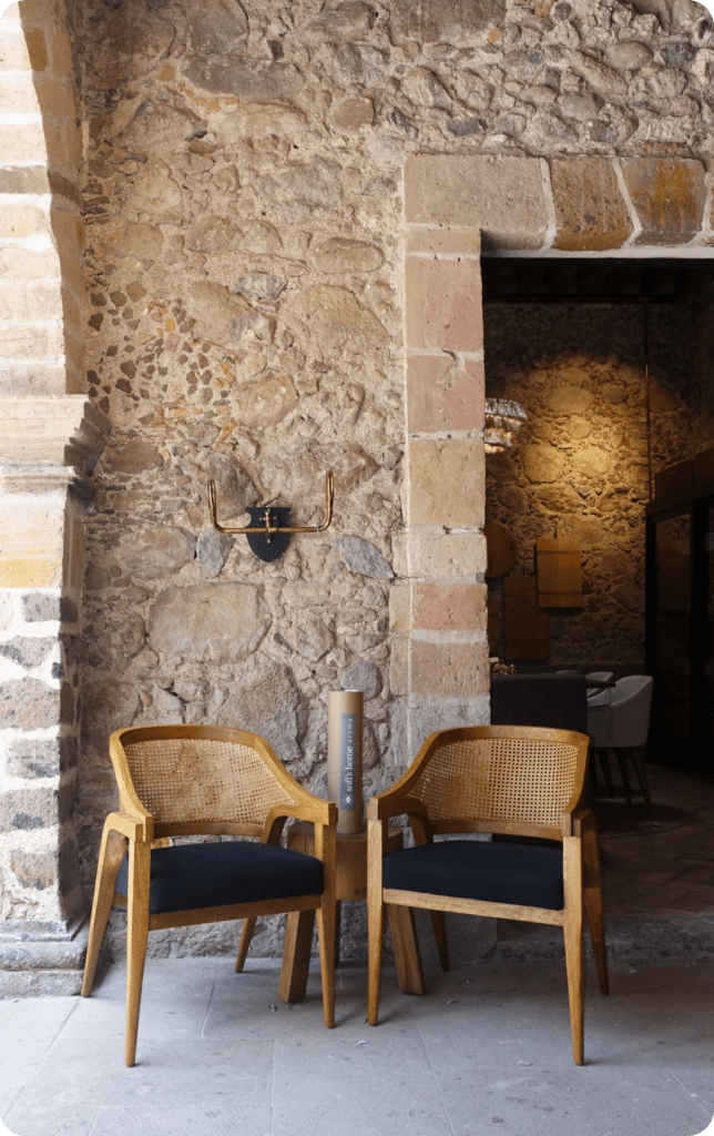 stone fireplace with chairs